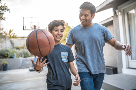 father-son-playing-basketball-outside